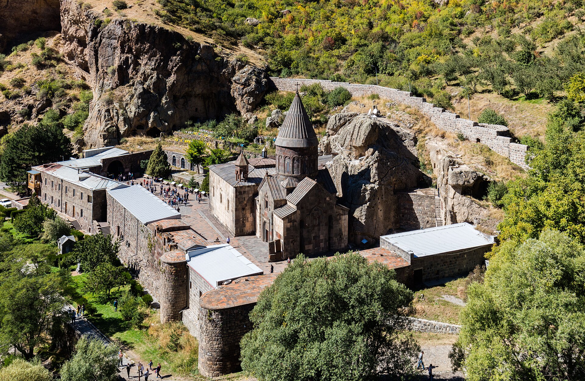 Geghard monastery built into the rock of a green gorge